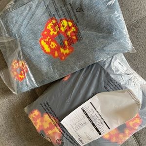 DENIM TEARS MENS BLACK HOODIE AND BLUE JEANS